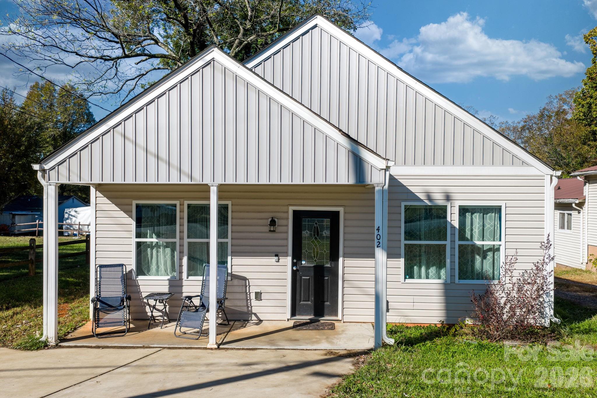 402 2nd Street Southwest Hickory, NC 28602 - Photo 20 of 24 a front view of a house with a yard