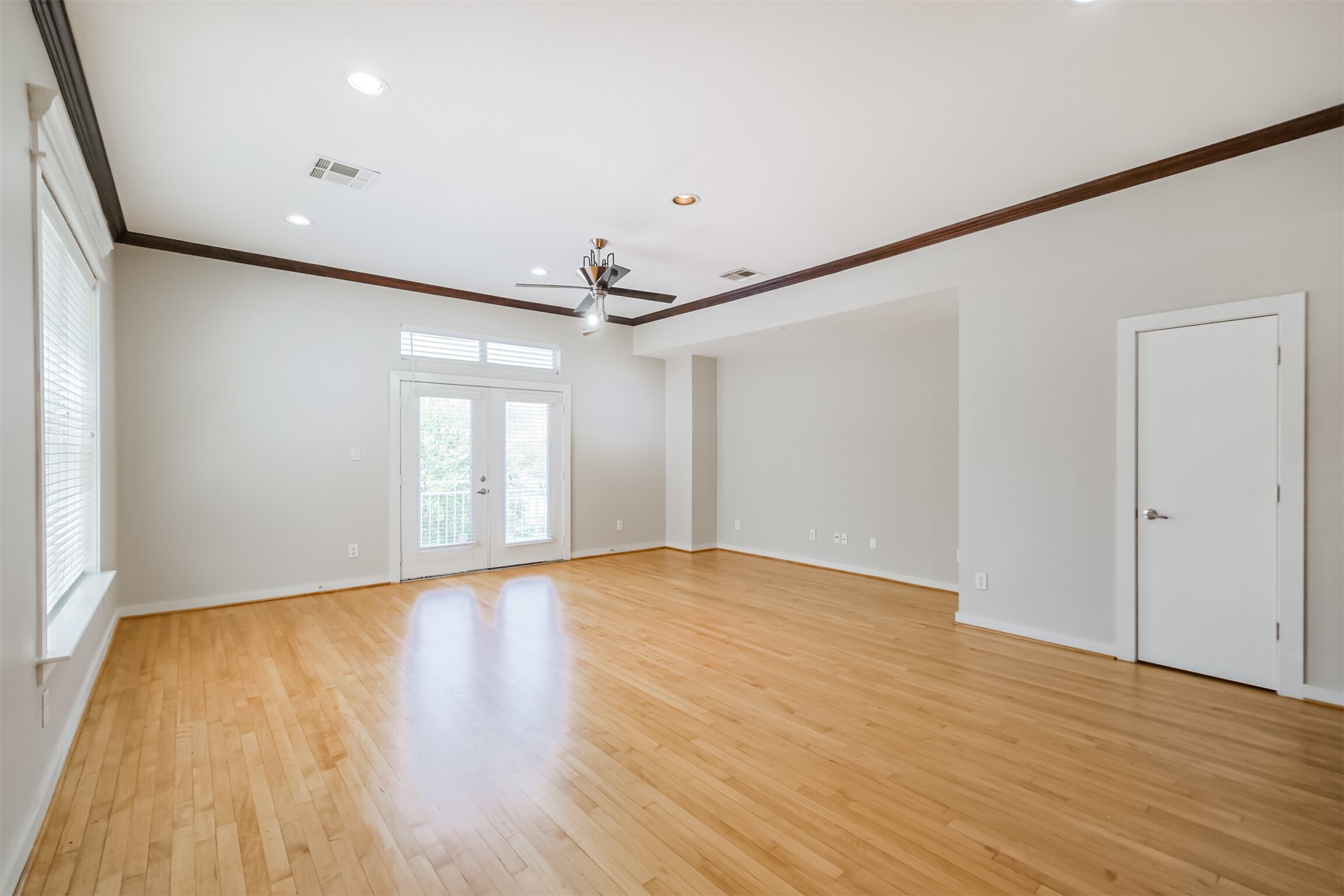 2364 Arlington Street Houston, TX 77008 - Photo 11 of 45 a view of empty room with wooden floor and fan
