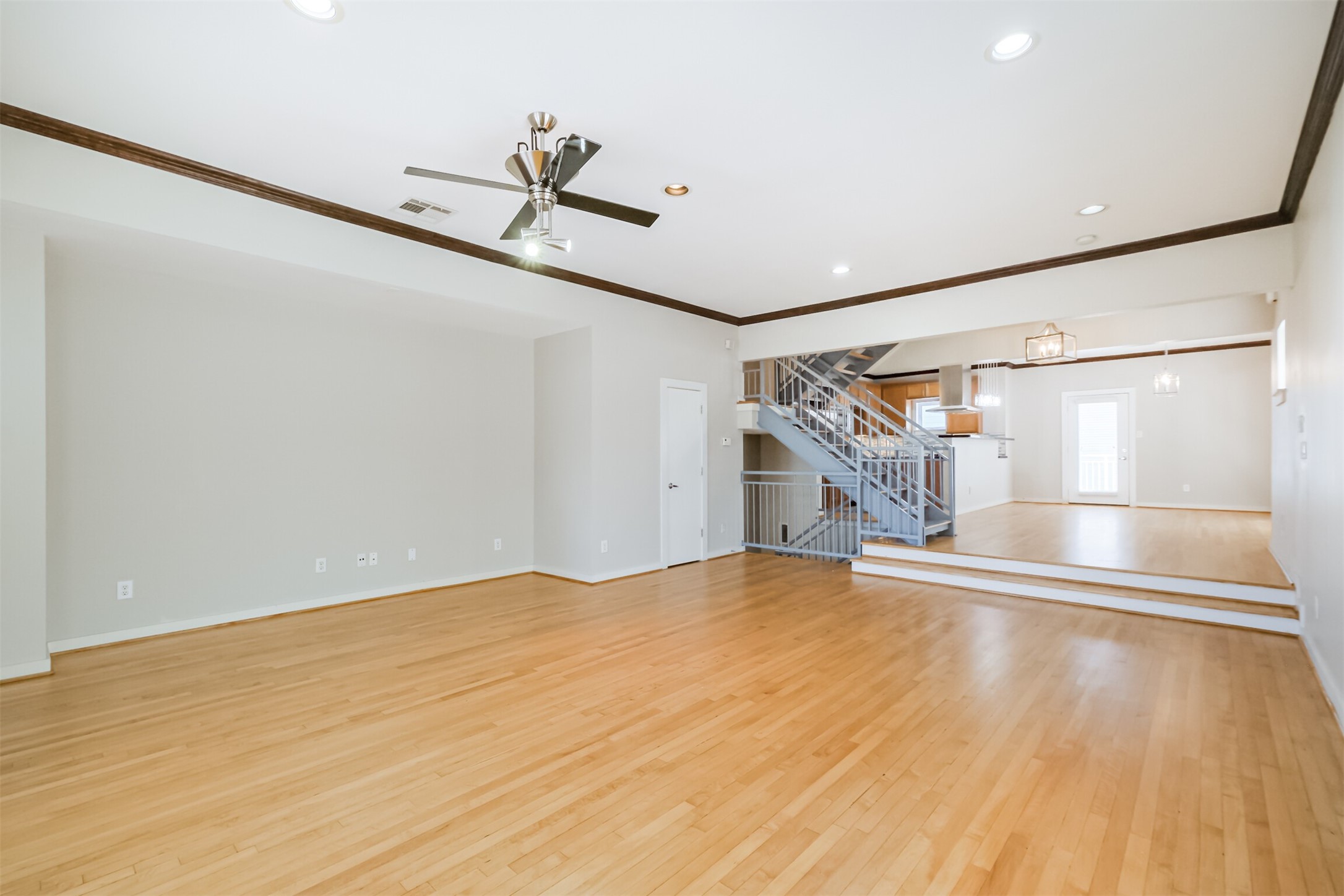 2364 Arlington Street Houston, TX 77008 - Photo 12 of 45 a view of empty room with wooden floor and fan