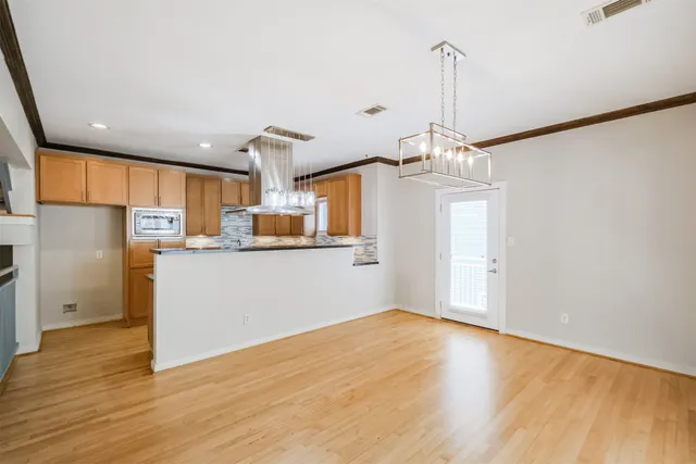 a kitchen with stainless steel appliances granite countertop a stove and a sink