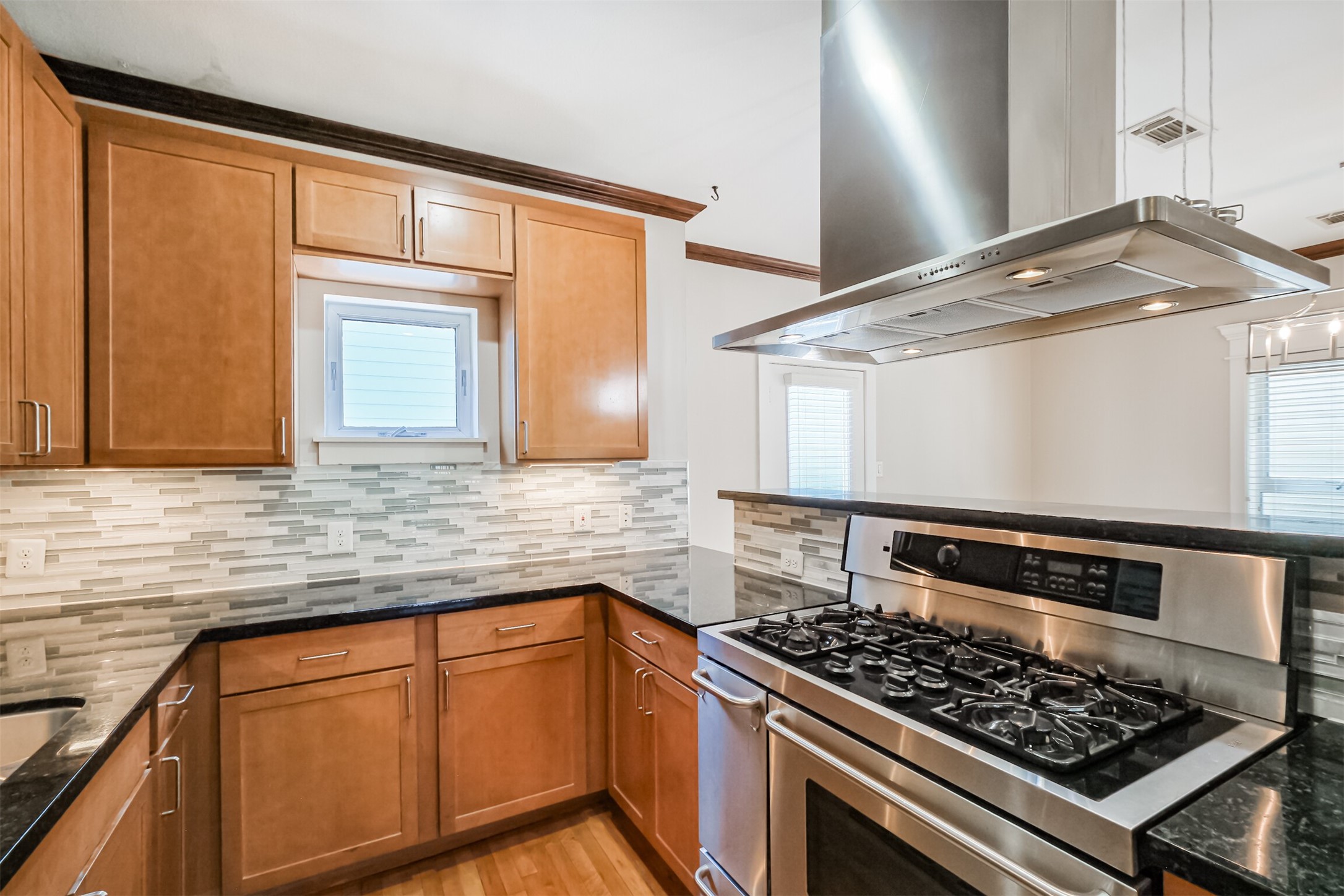 2364 Arlington Street Houston, TX 77008 - Photo 21 of 45 a kitchen with stainless steel appliances granite countertop a stove and a sink