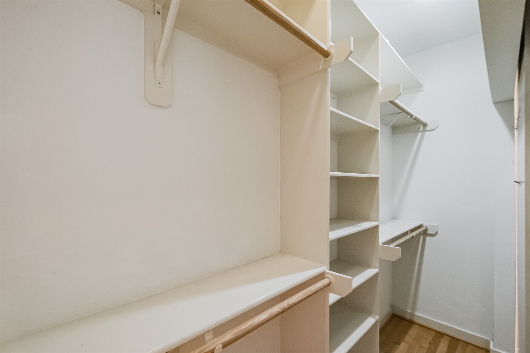 2364 Arlington Street Houston, TX 77008 - Photo 25 of 45 a view of walk in closet with empty racks