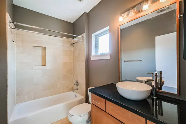 a kitchen with stainless steel appliances granite countertop a sink and cabinets