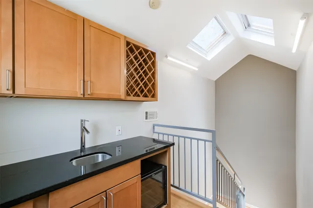 a view of deck with wooden floor and fence