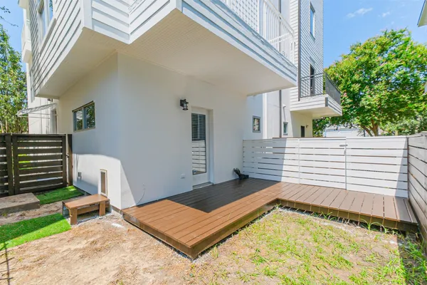 a view of a back yard from a balcony