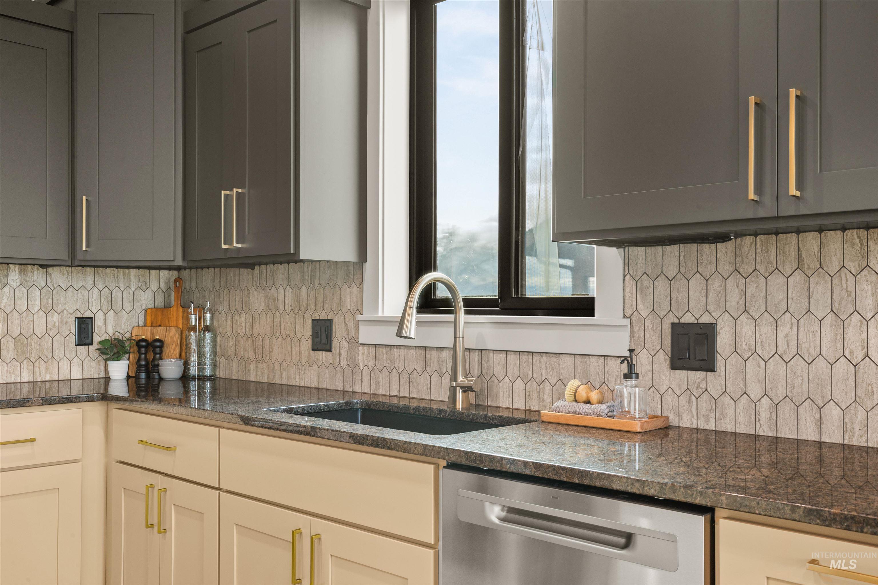 335 Warner Avenue Lewiston, ID 83501 - Photo 14 of 43 Kitchen featuring backsplash, dishwasher, and dark stone countertops
