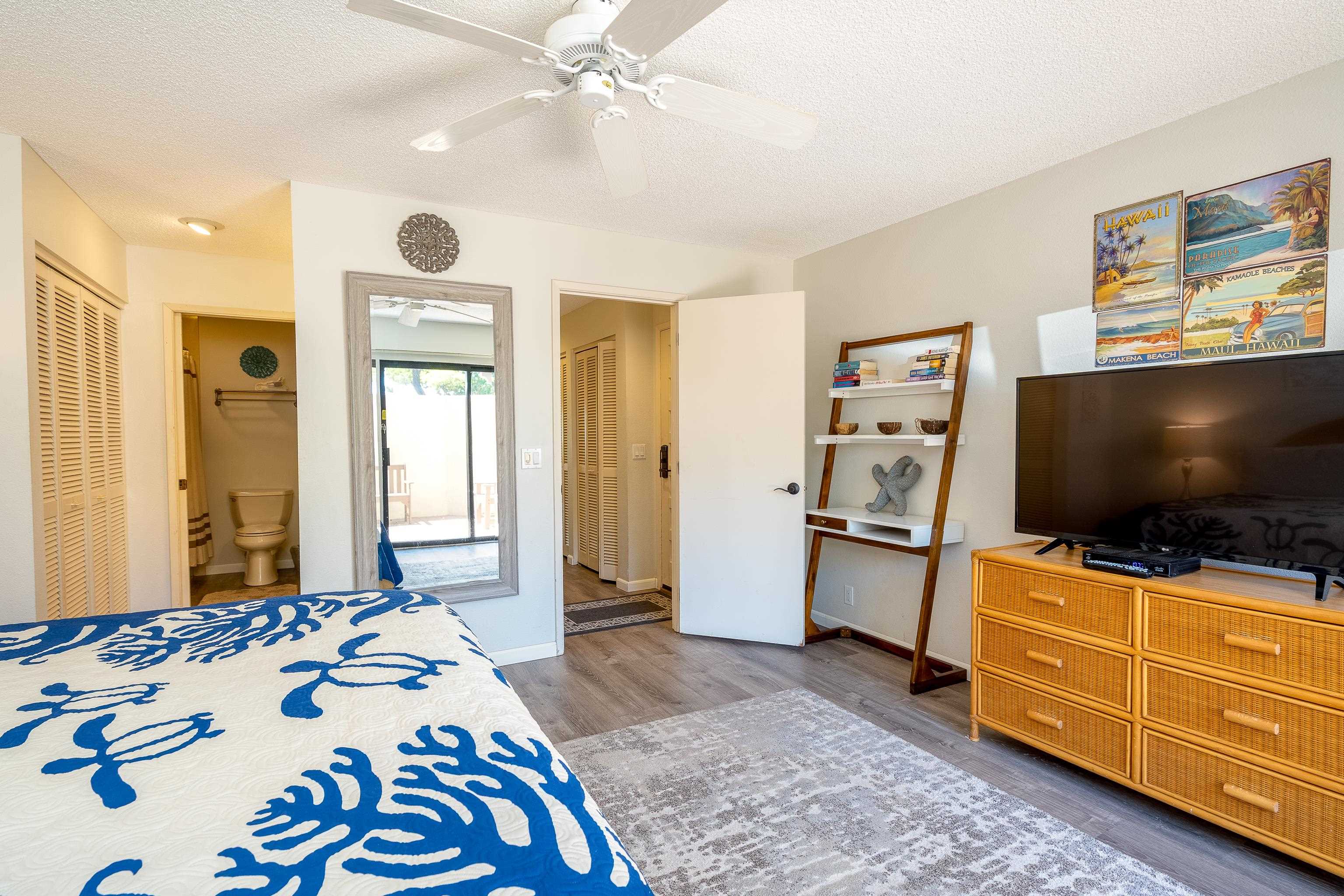2777 South Kihei Road, Unit G101 Kihei, HI 96753 - Photo 18 of 32 a bedroom with a bed and flat screen tv