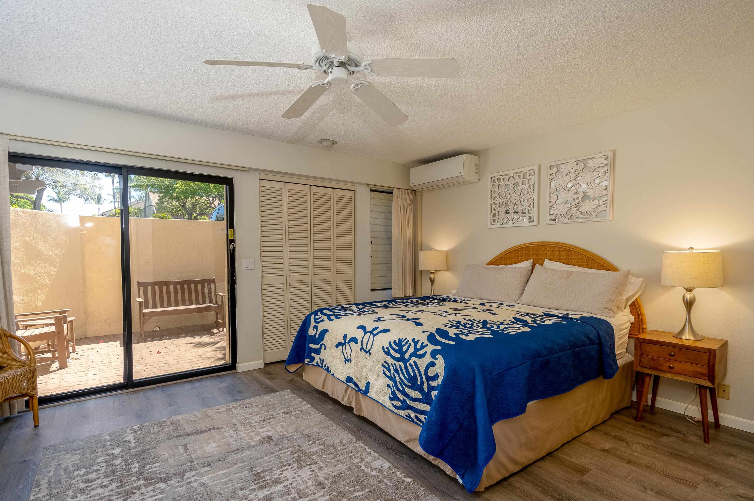 2777 South Kihei Road, Unit G101 Kihei, HI 96753 - Photo 19 of 32 a bedroom with a bed and wooden floor