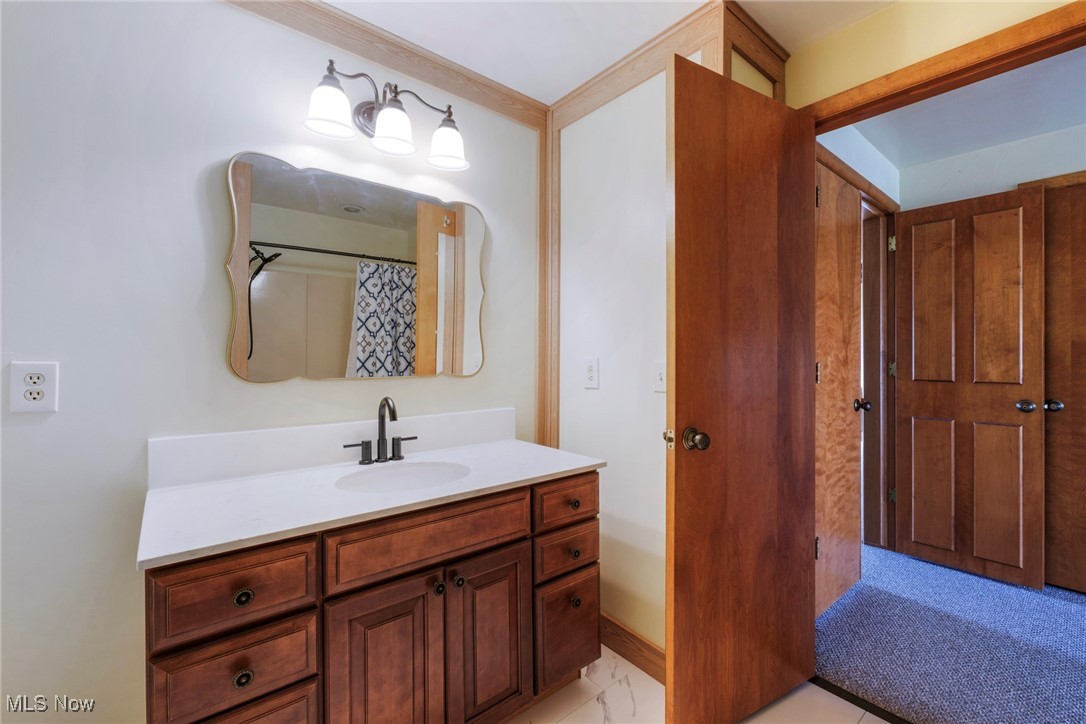 7059 Stewart Sharon Road Hubbard, OH 44425 - Photo 33 of 49 Bathroom featuring curtained shower and vanity