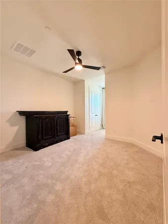 a very nice looking room with a ceiling fan