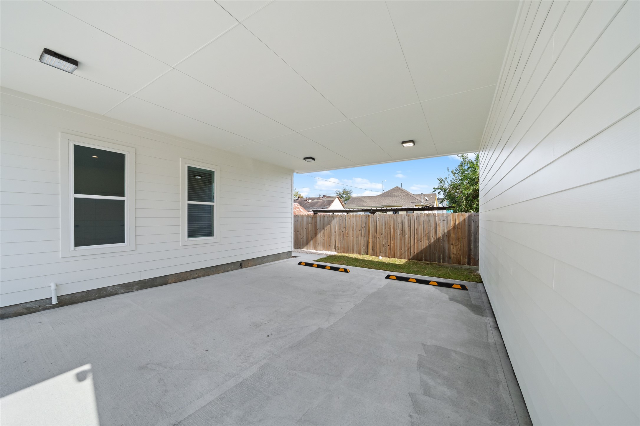 1408 Enid Street, Unit C Houston, TX 77009 - Photo 20 of 27 a view of an empty room with wooden floor and a window