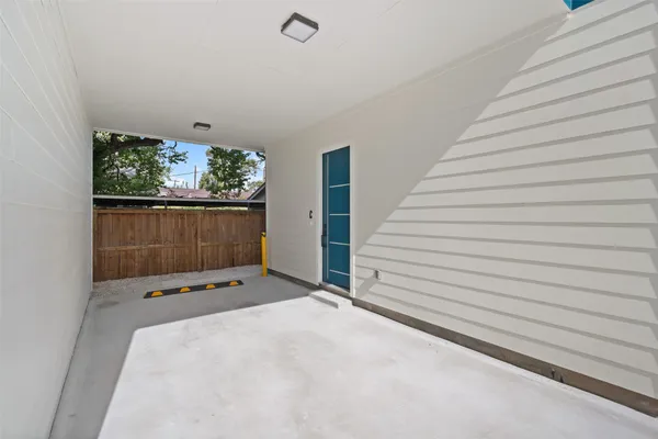 a view of an outdoor space with wooden fence