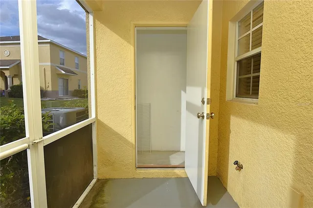 a view of potted plant in front of a door