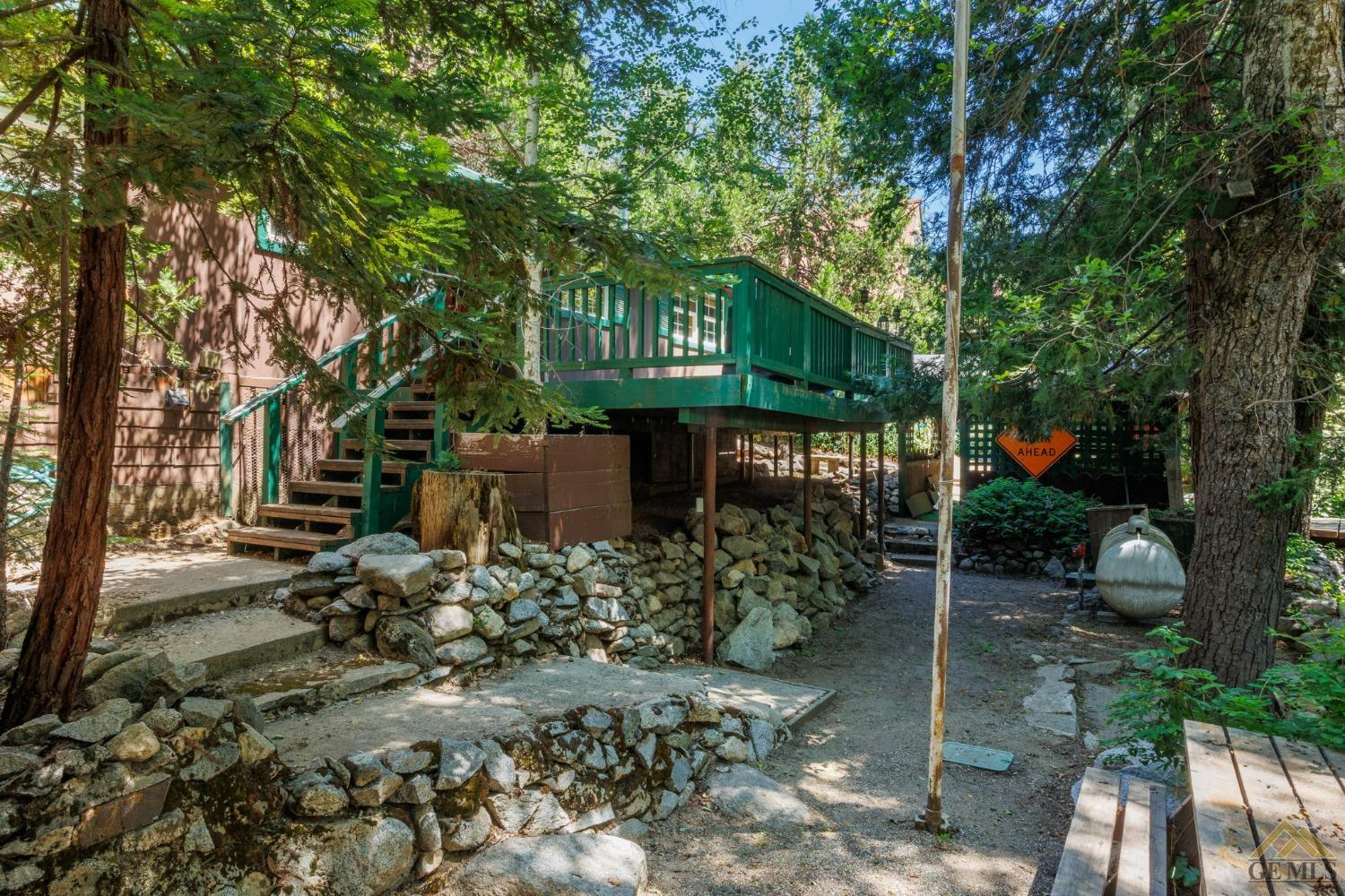 Undisclosed Address Posey, CA 93260 - Photo 39 of 50 a view of a chairs and table in the backyard