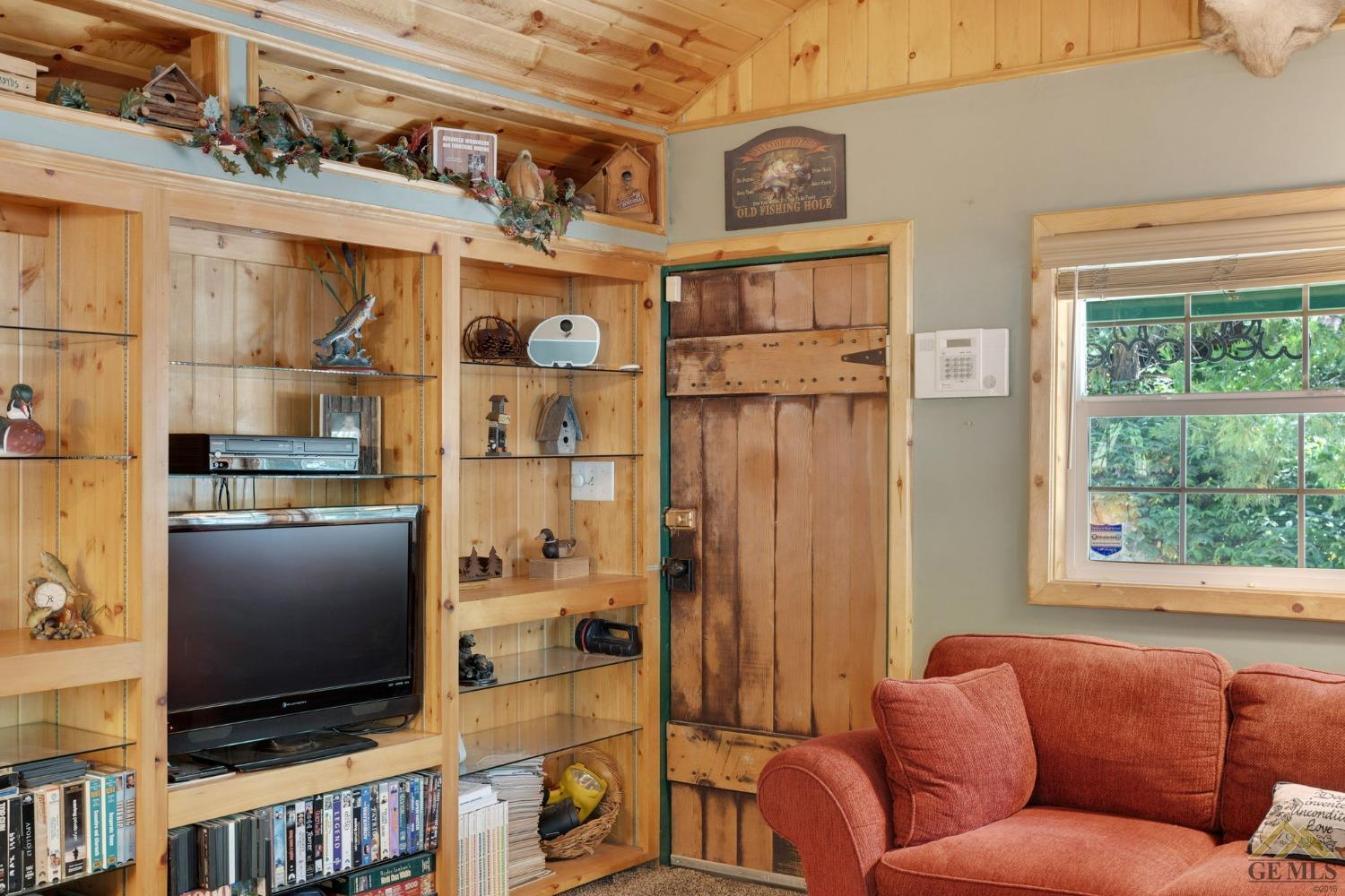 Undisclosed Address Posey, CA 93260 - Photo 7 of 50 a living room with furniture cabinets and a flat screen tv