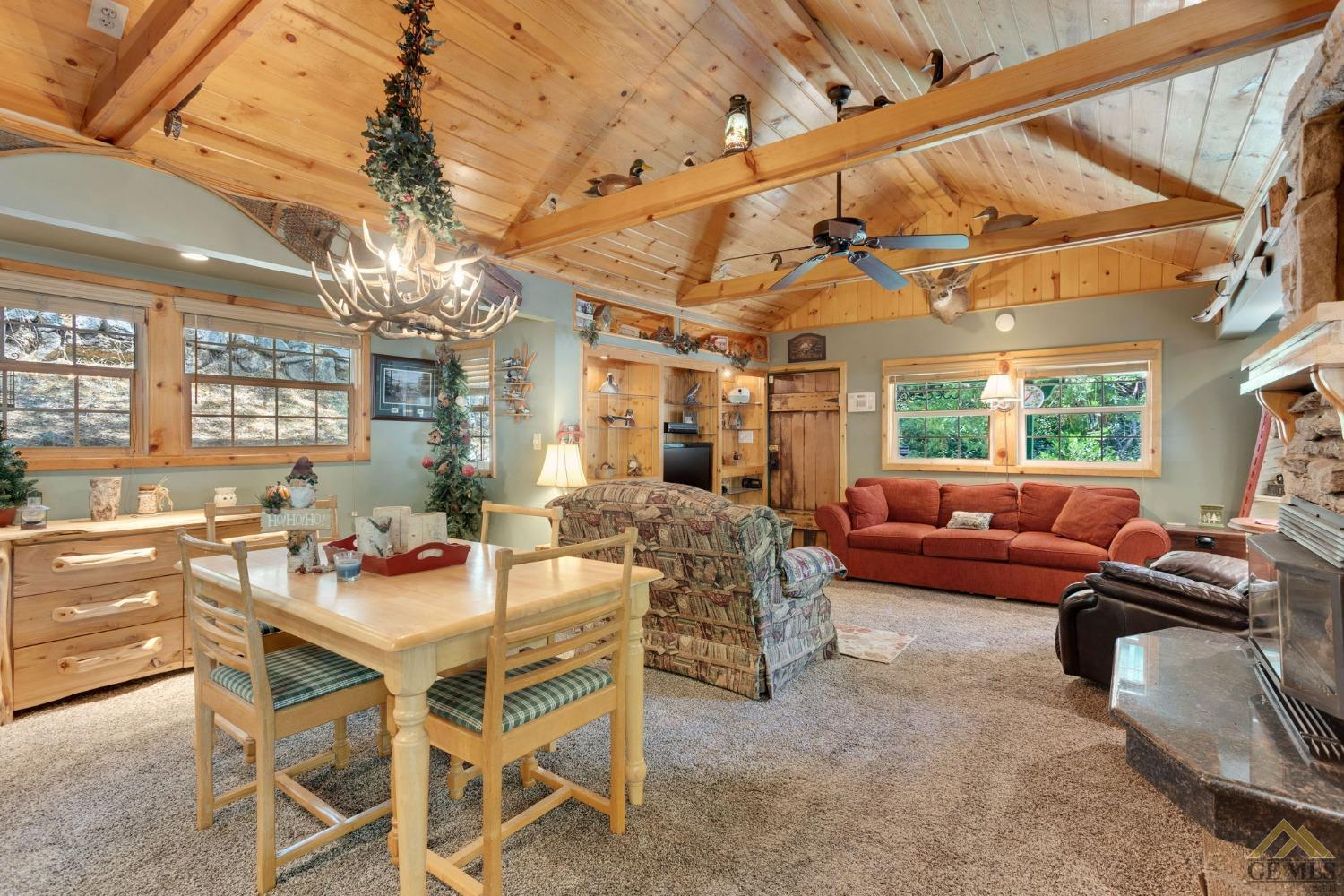 Undisclosed Address Posey, CA 93260 - Photo 9 of 50 a dining room with furniture a chandelier and window