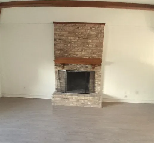 a living room with a fireplace