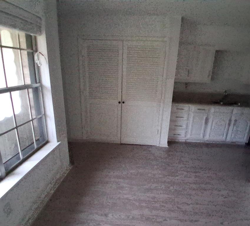 814 Oakbluff Drive Lancaster, TX 75146 - Photo 8 of 17 a view of an empty room with a window