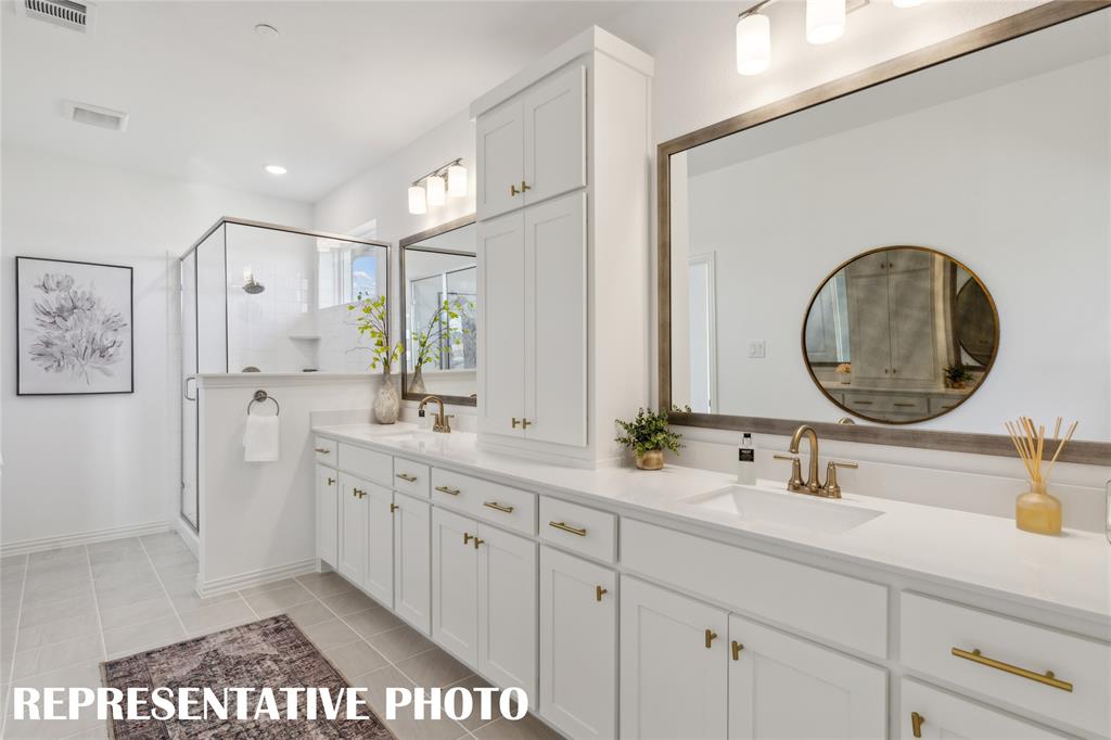 1303 Rooted Road Frisco, TX 75033 - Photo 10 of 14 a bathroom with a double vanity sink and a mirror