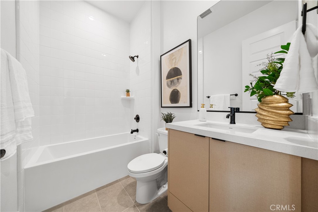 18302 Saddle Crest Silverado, CA 92676 - Photo 21 of 40 a bathroom with a sink a toilet and shower