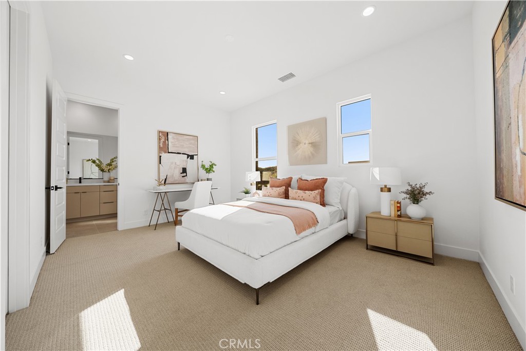 18302 Saddle Crest Silverado, CA 92676 - Photo 22 of 40 a spacious bedroom with a bed and a couch