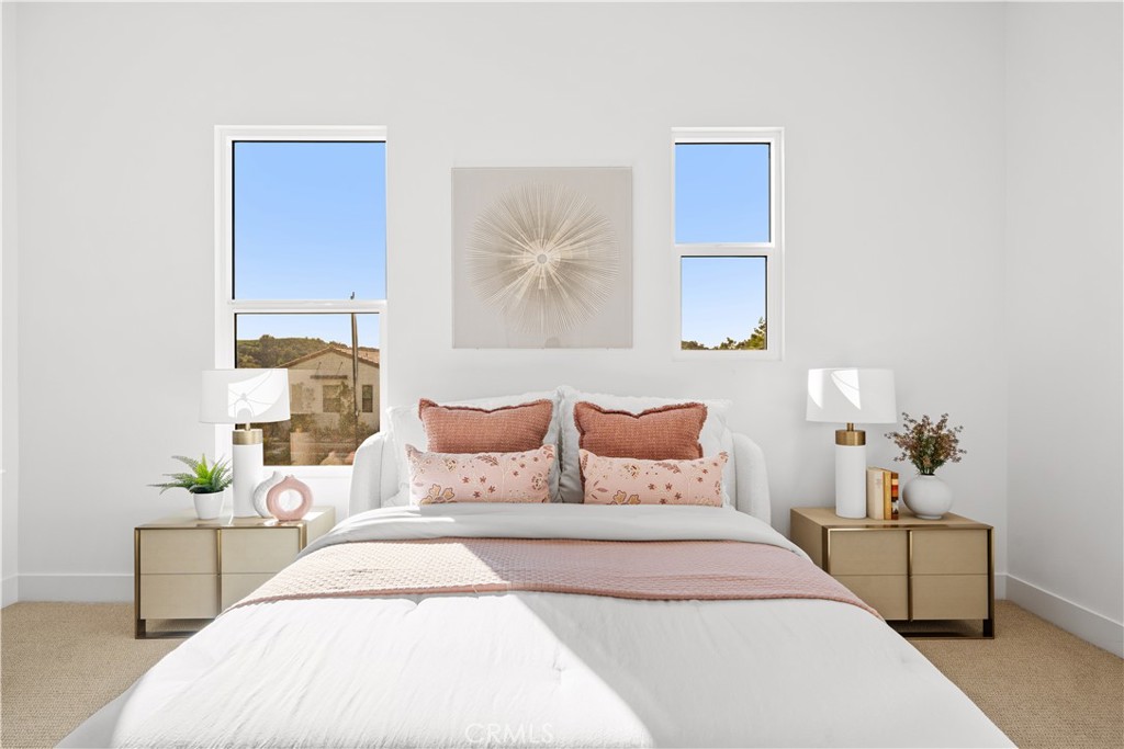 18302 Saddle Crest Silverado, CA 92676 - Photo 23 of 40 a bedroom with a bed and a potted plant