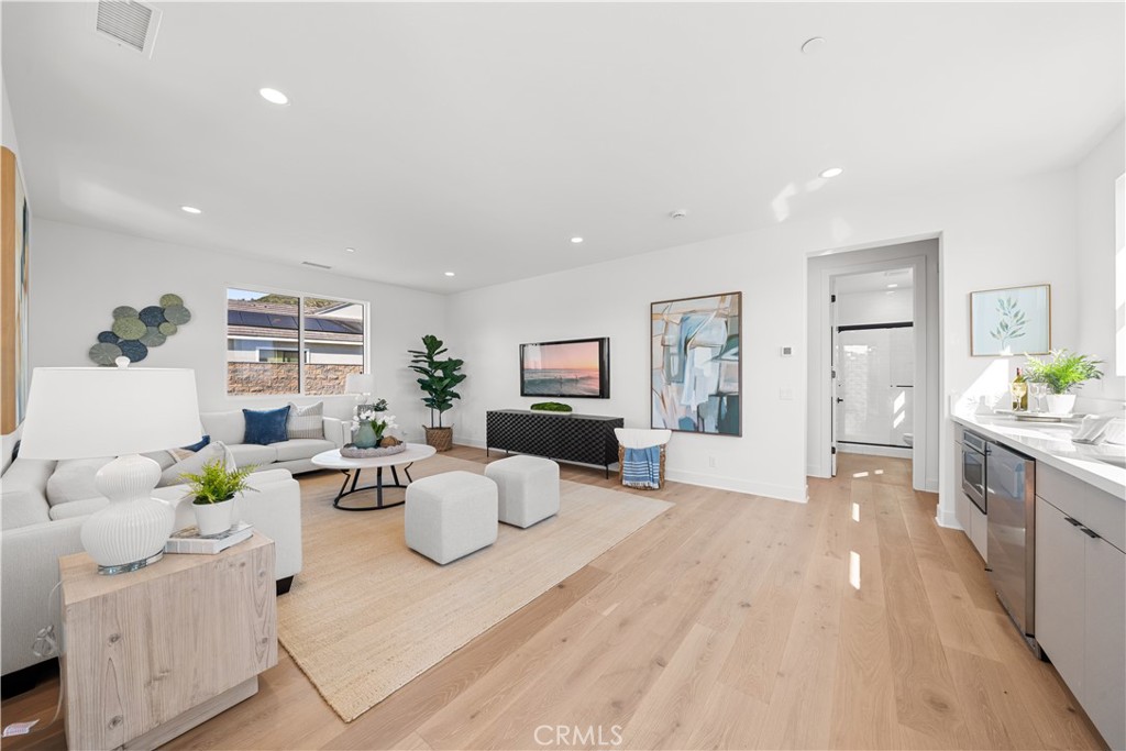 18302 Saddle Crest Silverado, CA 92676 - Photo 26 of 40 a living room with furniture and wooden floor