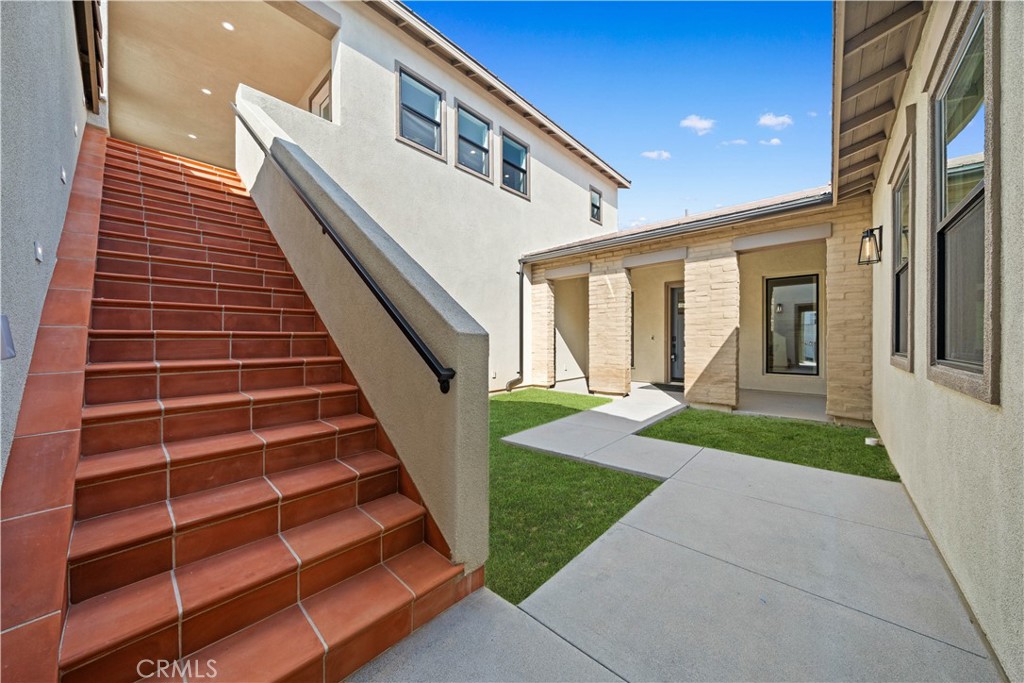 18302 Saddle Crest Silverado, CA 92676 - Photo 27 of 40 a front view of a house with a yard