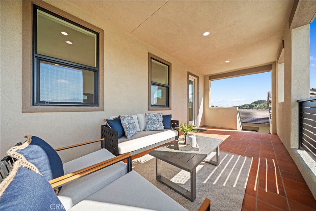 18302 Saddle Crest Silverado, CA 92676 - Photo 28 of 40 a living room with furniture and floor to ceiling windows