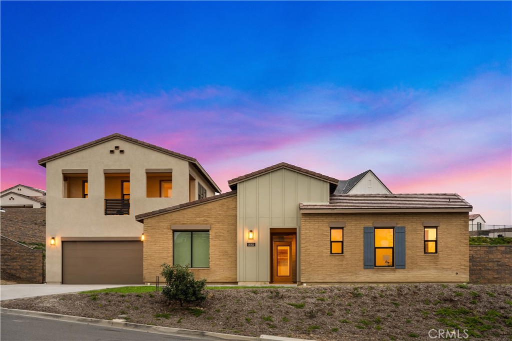18302 Saddle Crest Silverado, CA 92676 - Photo 34 of 40 a front view of a house with a yard