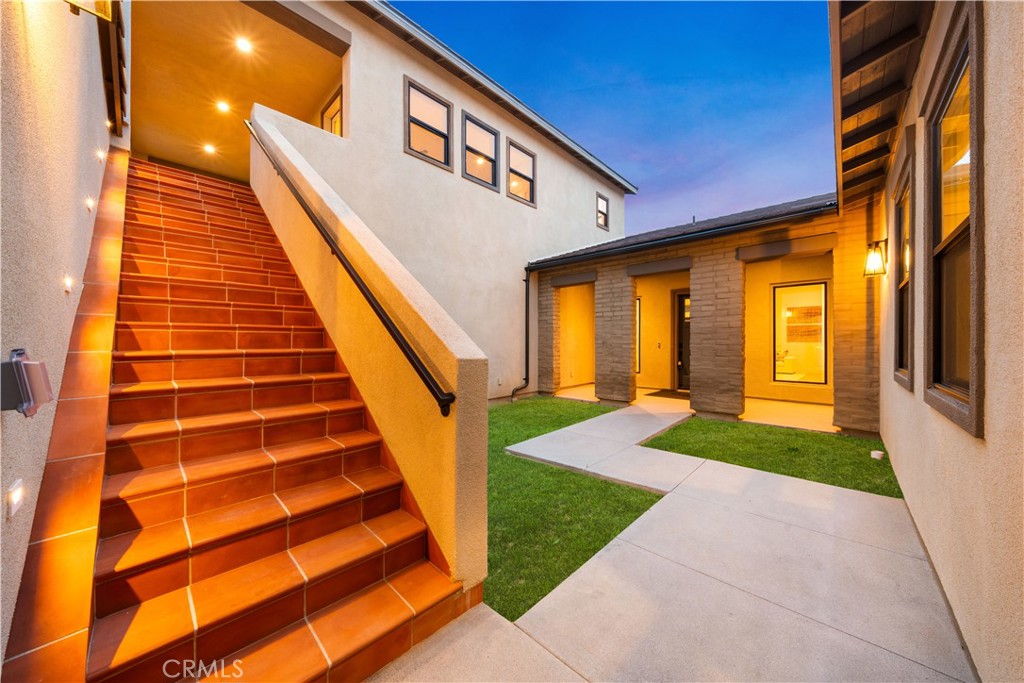 18302 Saddle Crest Silverado, CA 92676 - Photo 35 of 40 a front view of a house with a yard