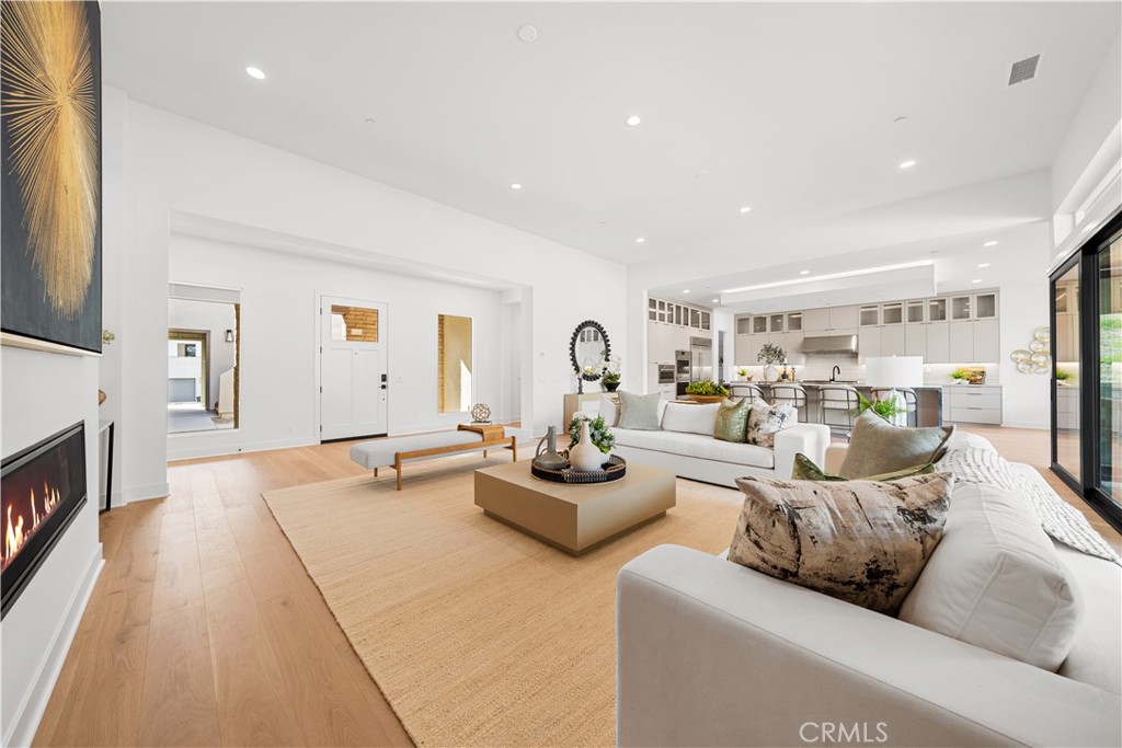 18302 Saddle Crest Silverado, CA 92676 - Photo 5 of 40 a living room with fireplace furniture and a wooden floor