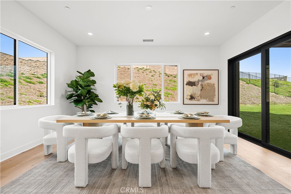 18302 Saddle Crest Silverado, CA 92676 - Photo 9 of 40 a dining room with furniture window and wooden floor