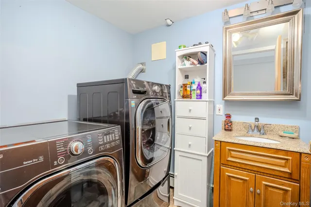 a utility room with dryer and washer