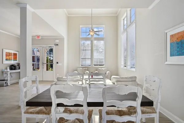 a dining room with furniture and window