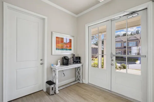 a room with cabinets and painting on the wall