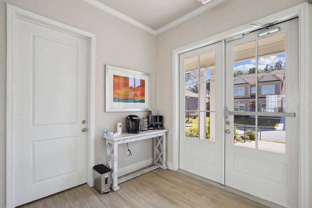 1852 Auburn Road, Unit GRANTVIEW Dacula, GA 30019 - Photo 31 of 31 a room with cabinets and painting on the wall
