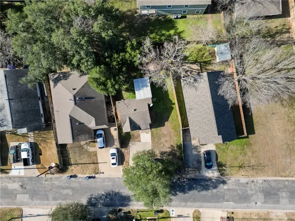an aerial view of residential houses with outdoor space