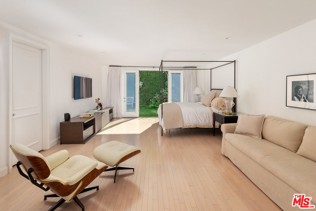 9770 San Circle Beverly Hills, CA 90210 - Photo 13 of 29 a living room with furniture and a large window