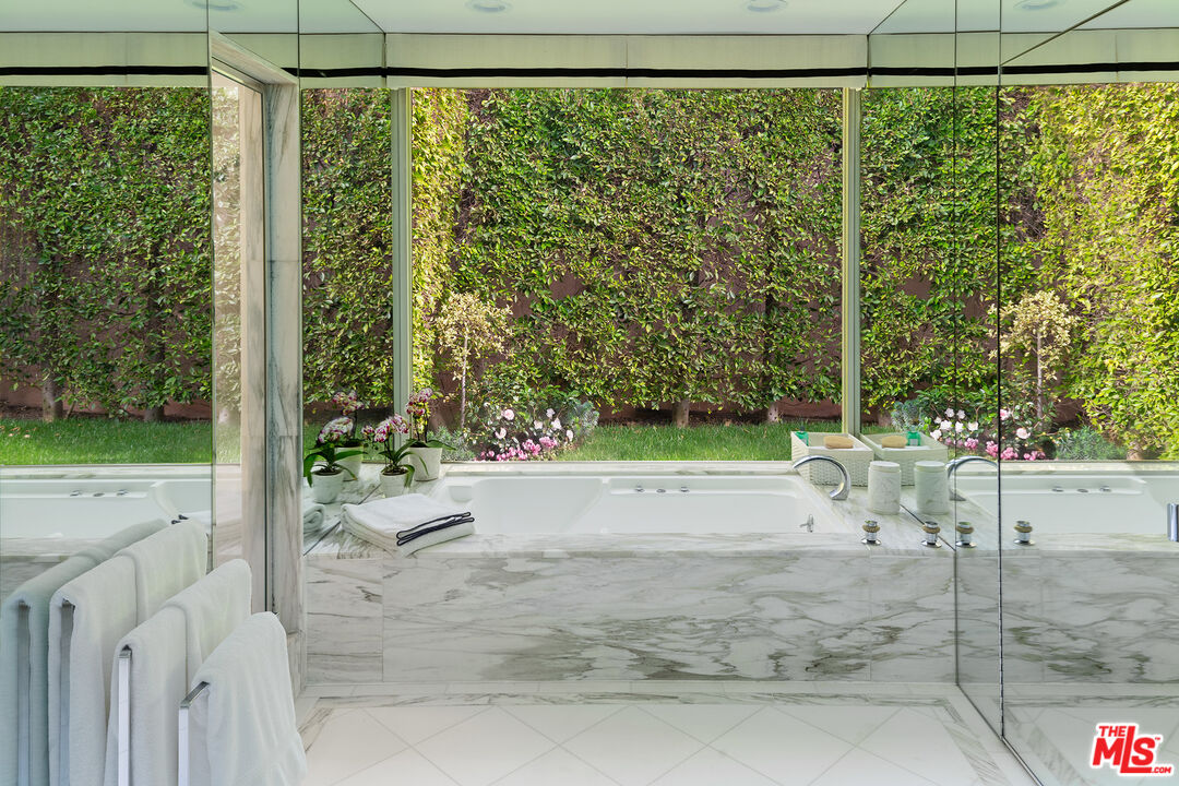 9770 San Circle Beverly Hills, CA 90210 - Photo 14 of 29 a white bench sitting in front of a building