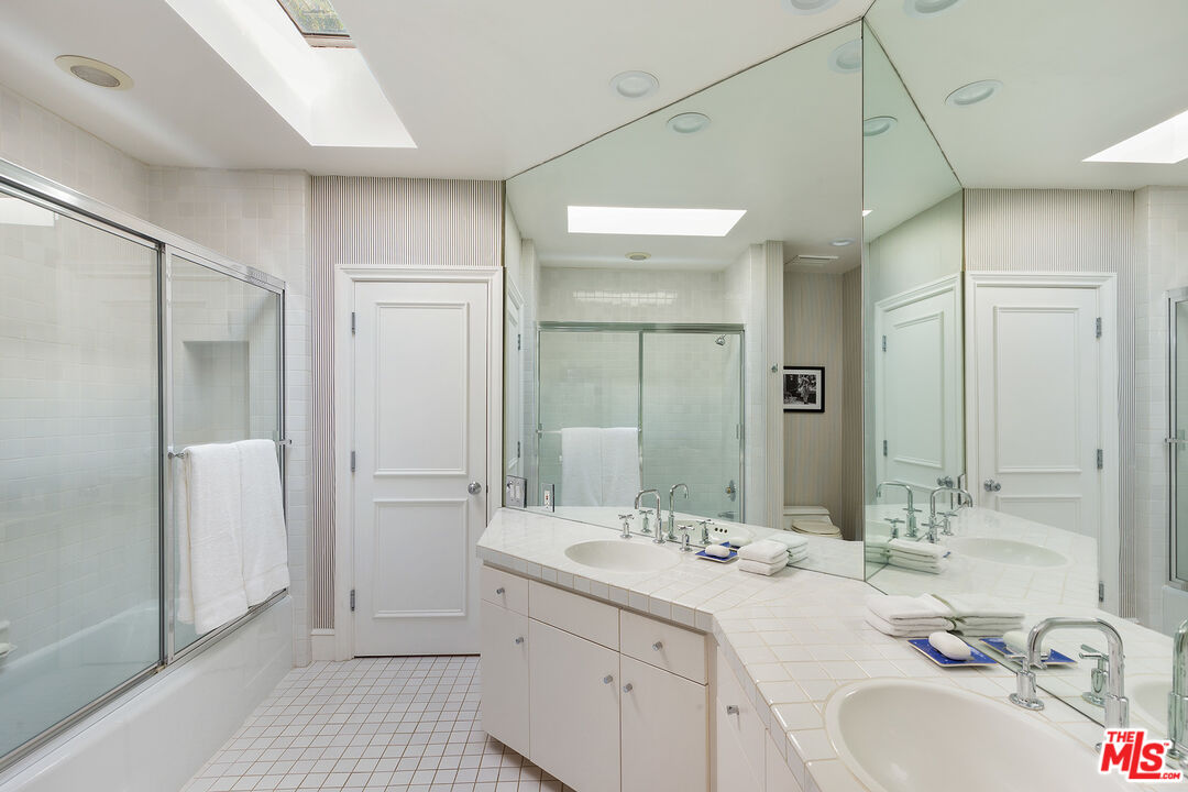 9770 San Circle Beverly Hills, CA 90210 - Photo 17 of 29 a bathroom with a double vanity sink mirror and double