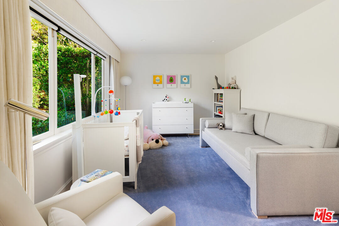 9770 San Circle Beverly Hills, CA 90210 - Photo 18 of 29 a room with furniture and a window