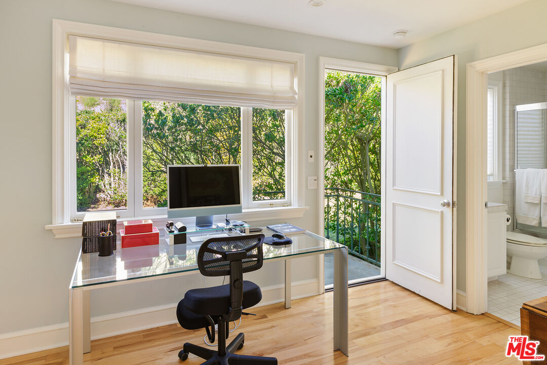 9770 San Circle Beverly Hills, CA 90210 - Photo 19 of 29 a view of a workspace with furniture and a window