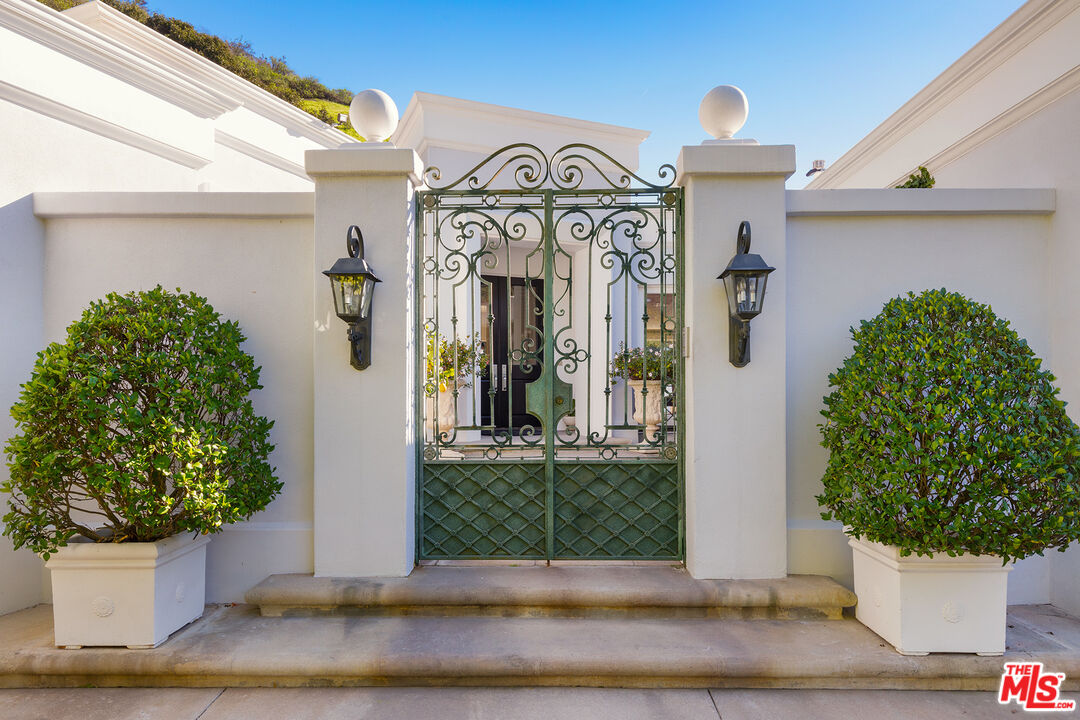 9770 San Circle Beverly Hills, CA 90210 - Photo 2 of 29 a view of a house with potted plants