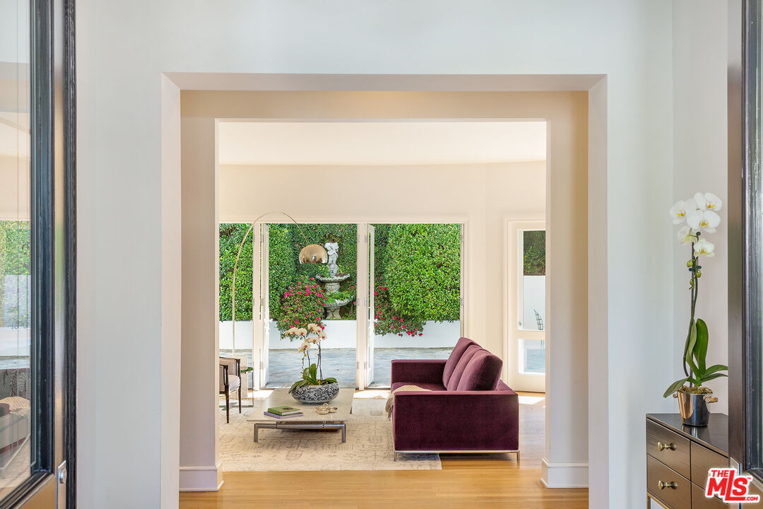 9770 San Circle Beverly Hills, CA 90210 - Photo 5 of 29 a living room with furniture and a large window