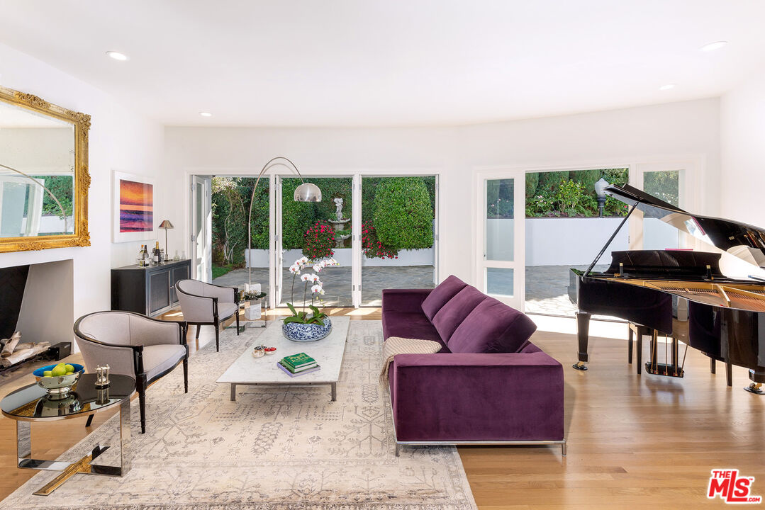 9770 San Circle Beverly Hills, CA 90210 - Photo 6 of 29 a living room with furniture and a large window