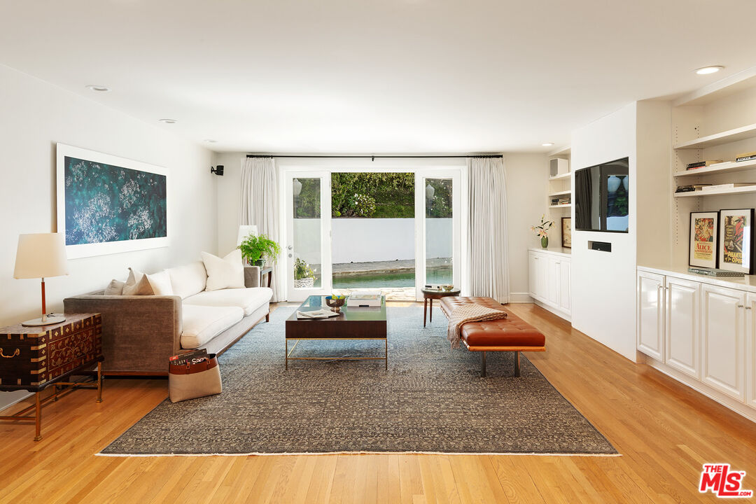 9770 San Circle Beverly Hills, CA 90210 - Photo 8 of 29 a living room with furniture and a large window