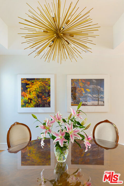 9770 San Circle Beverly Hills, CA 90210 - Photo 9 of 29 a room with painting and a potted plant