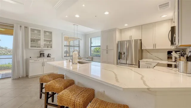 a bedroom with a large bed and a large window