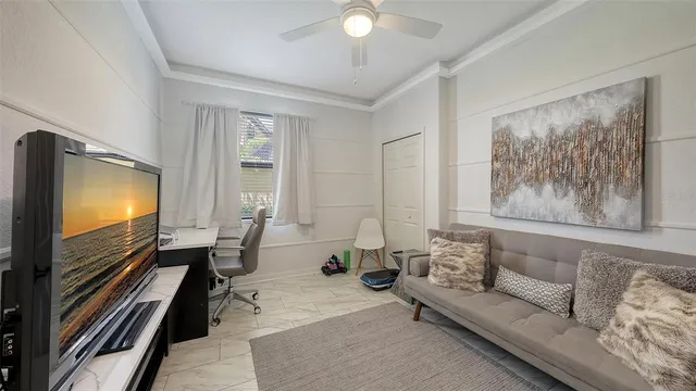 an aerial view of a swimming pool a yard and outdoor seating